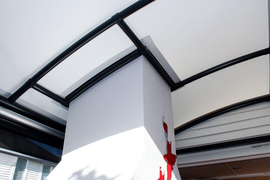 awning-nz-5 outdoor room with fireplace covered by a fresco canopy